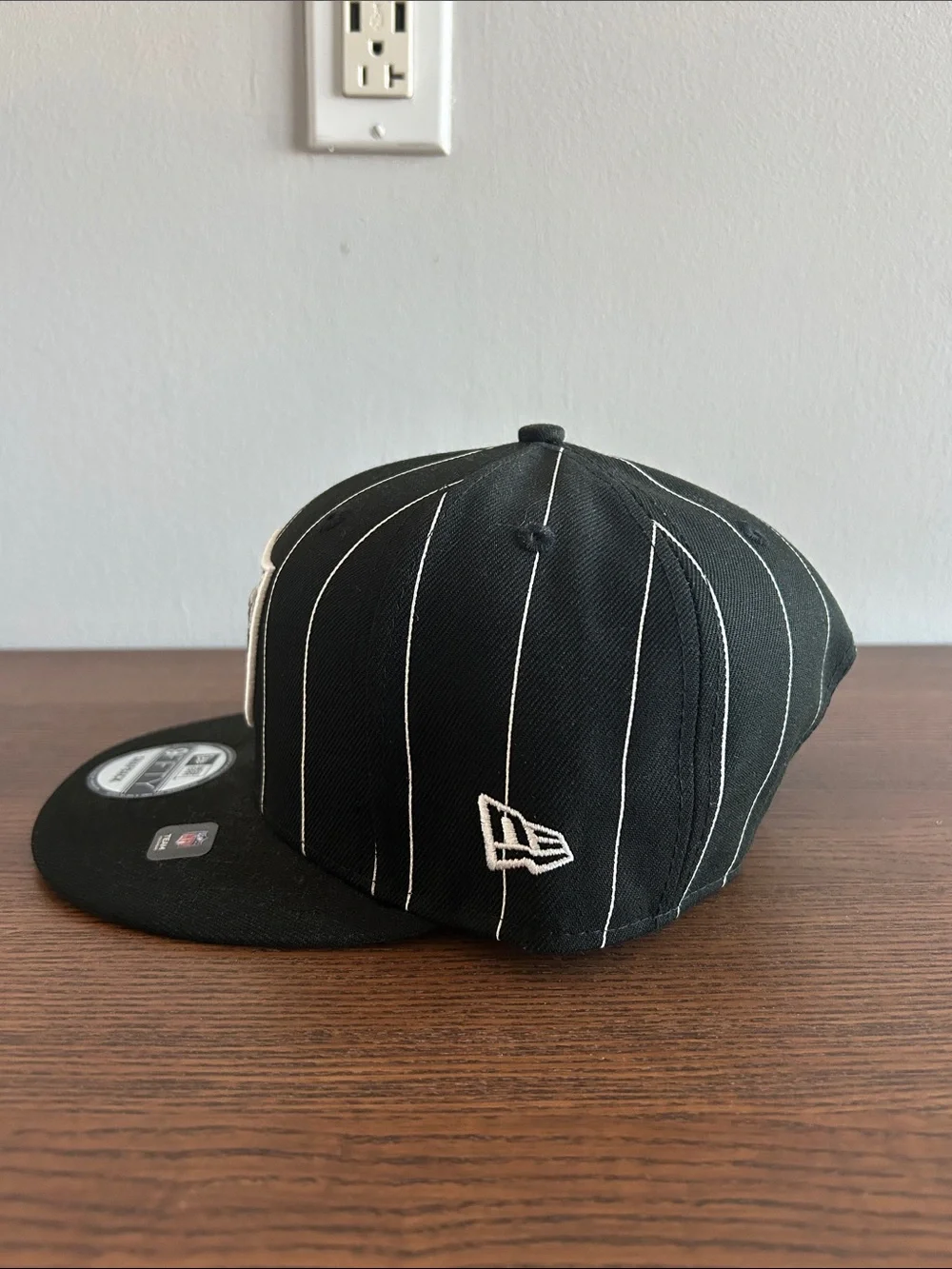 New Era Black & White Raiders Pinstripe Snapback Hat